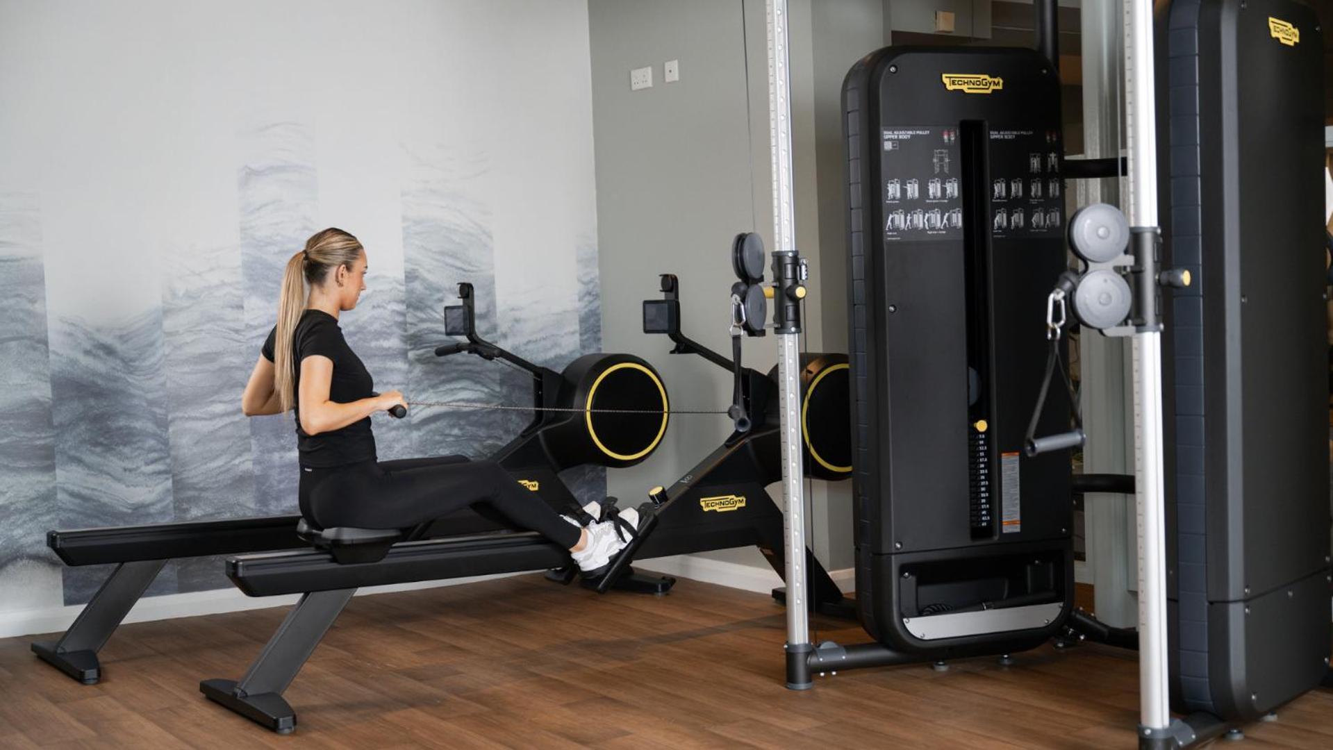 The Culloden Estate And Spa Holywood  Ngoại thất bức ảnh A woman using a rowing machine