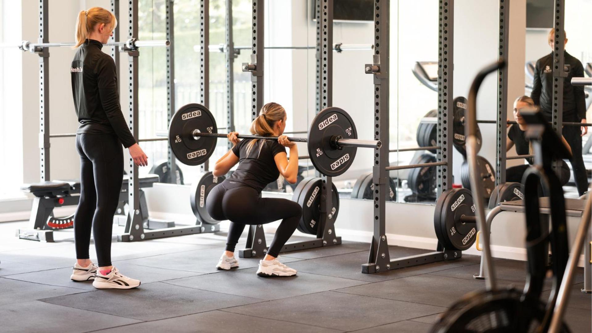 The Culloden Estate And Spa Holywood  Ngoại thất bức ảnh A woman performing a back squat with a barbell